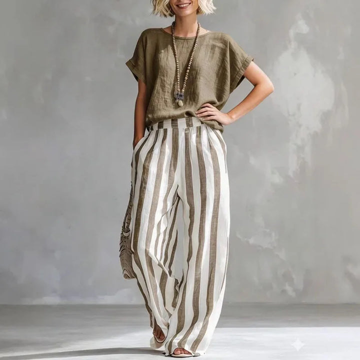 Stylish women's two-piece striped cotton-linen set with loose top and wide-leg pants for summer.
