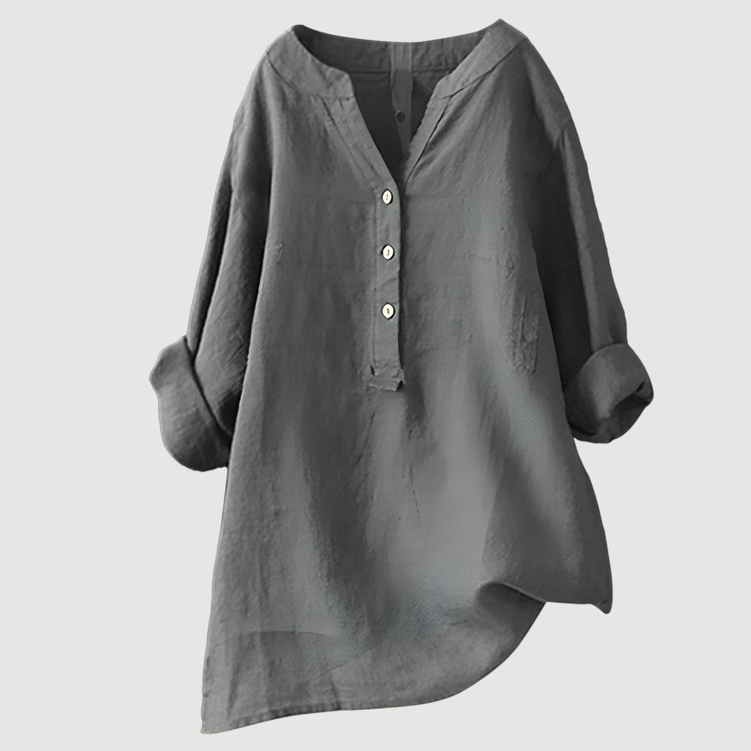 Button-up women's blouse with rolled sleeves, perfect for summer fashion & comfort.