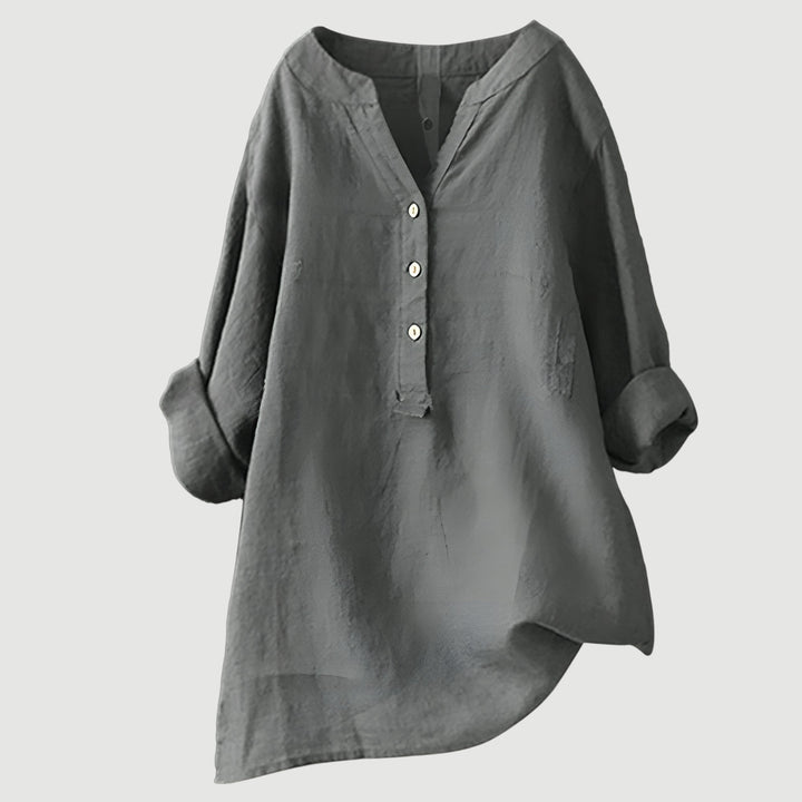 Button-up women's blouse with rolled sleeves, perfect for summer fashion & comfort.