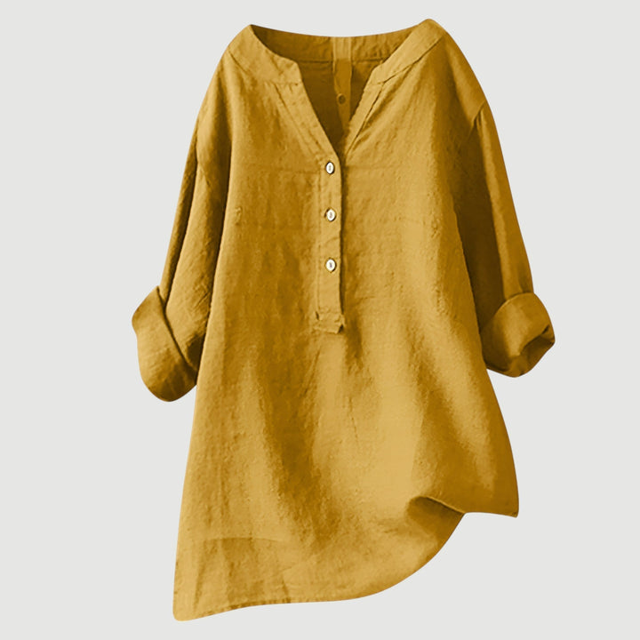 Women's loose fit v-neck blouse with rolled sleeves, elegant & comfortable for spring.