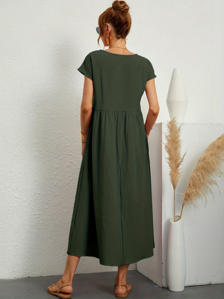 Comfortable women's short sleeve loose fit maxi dress, featuring a round neck & practical pockets.