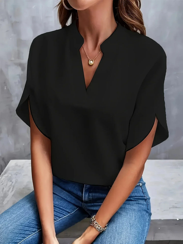 Stylish women's short sleeve V-neck blouse, loose fit design for ultimate comfort & everyday elegance.