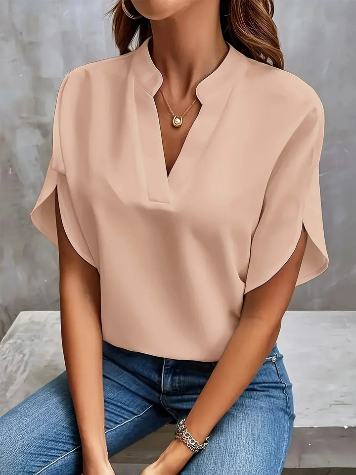 Comfortable women's loose fit V-neck tunic blouse, short sleeve, perfect for relaxed summer days.
