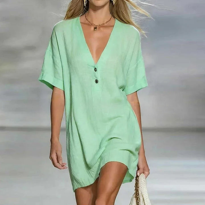 Relaxed fit women's V-neck shirt dress in motion, showing its loose silhouette, great for summer casual.