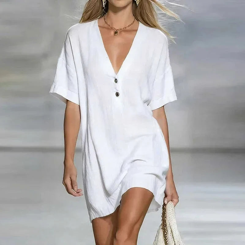 Back view of a women's casual loose fit V-neck shirt dress, showcasing its relaxed summer design.