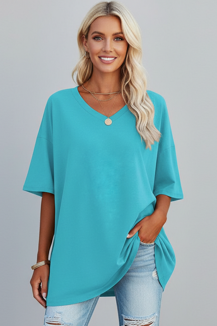 Comfortable women's loose V-neck top, short sleeve. Ideal for casual wear and summer fashion.