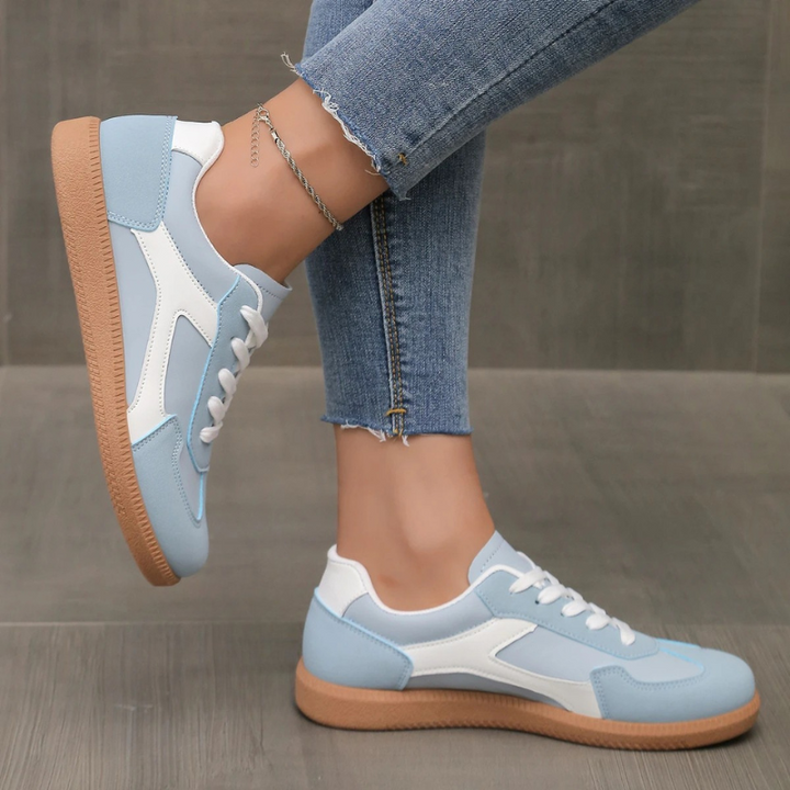 Comfortable women's casual walking shoes, low profile design with a cushioned insole and gum sole.