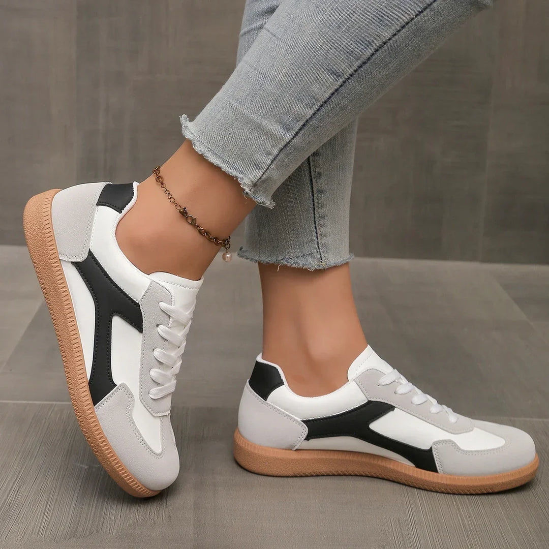 Athletic casual women's sneakers, low profile with a supportive cushioned fit and iconic gum sole.