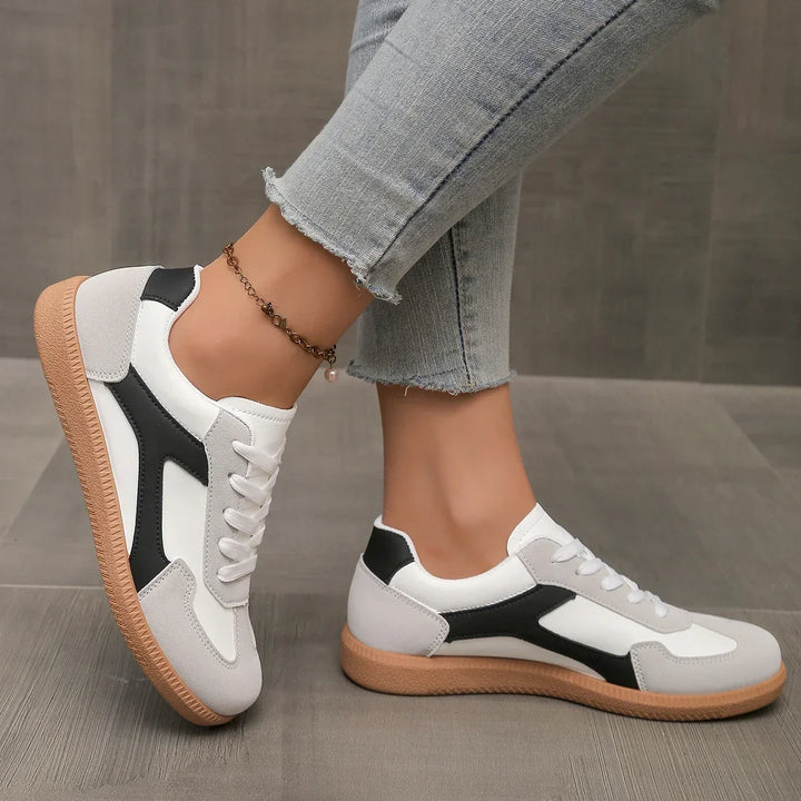 Athletic casual women's sneakers, low profile with a supportive cushioned fit and iconic gum sole.