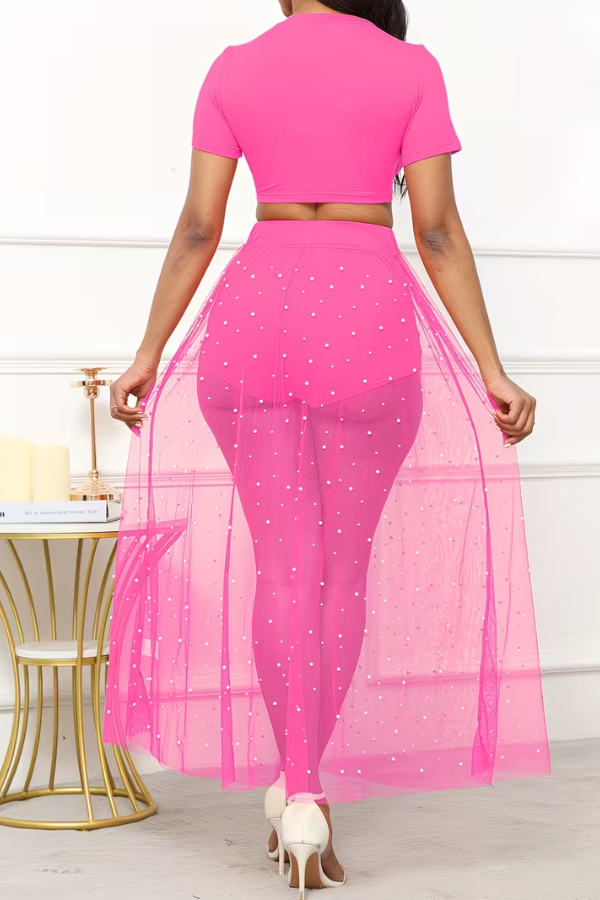 Luxe women's 3-piece set featuring a detailed pearl sheer skirt, cropped top & matching piece for resort.