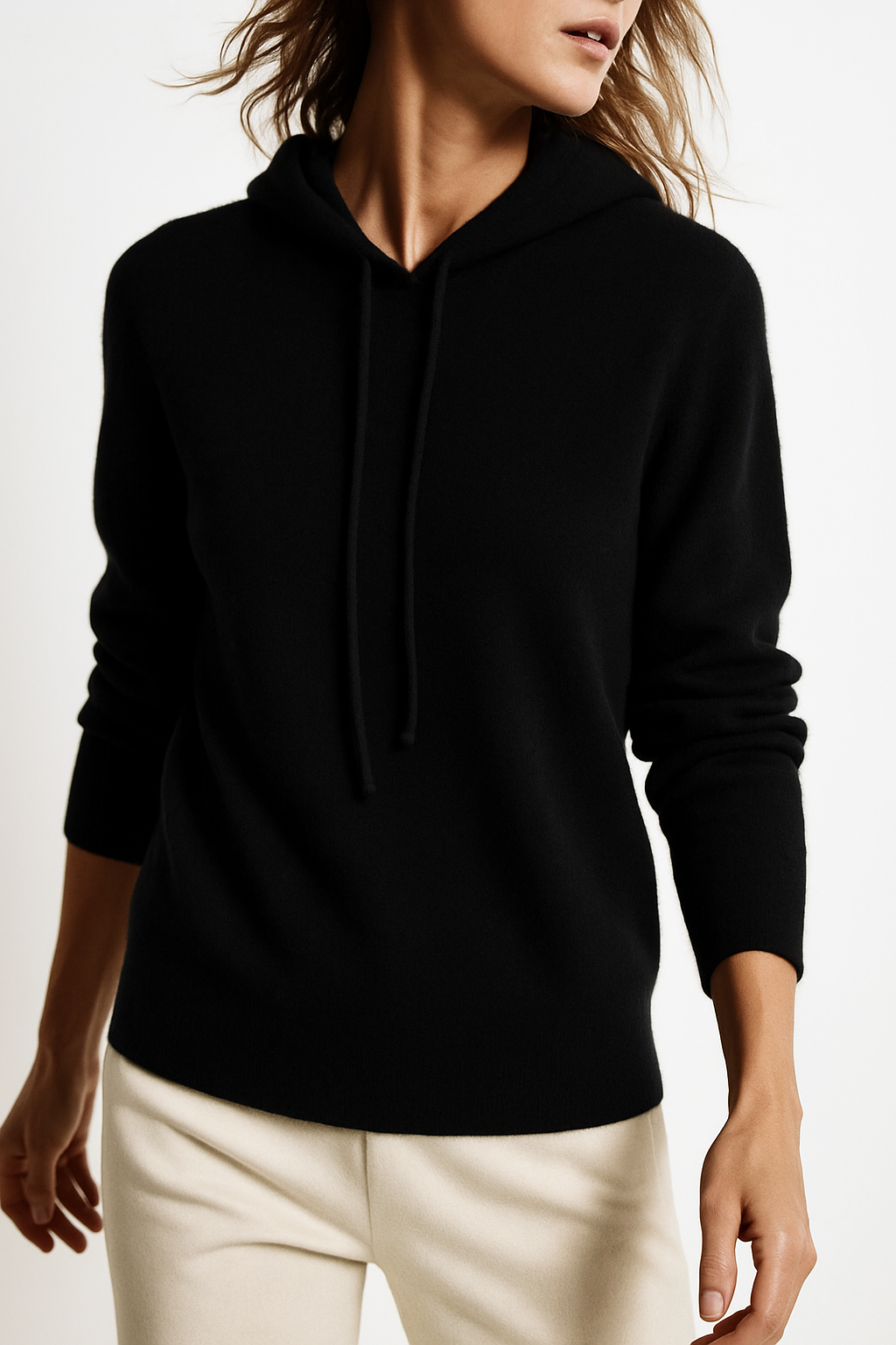 Woman laughing, wearing the soft and cozy Women's Relaxed Hoodie, loungewear