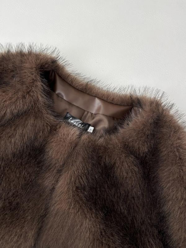 Elegant women's faux fur jacket, voluminous and plush, perfect luxury winter outerwear
