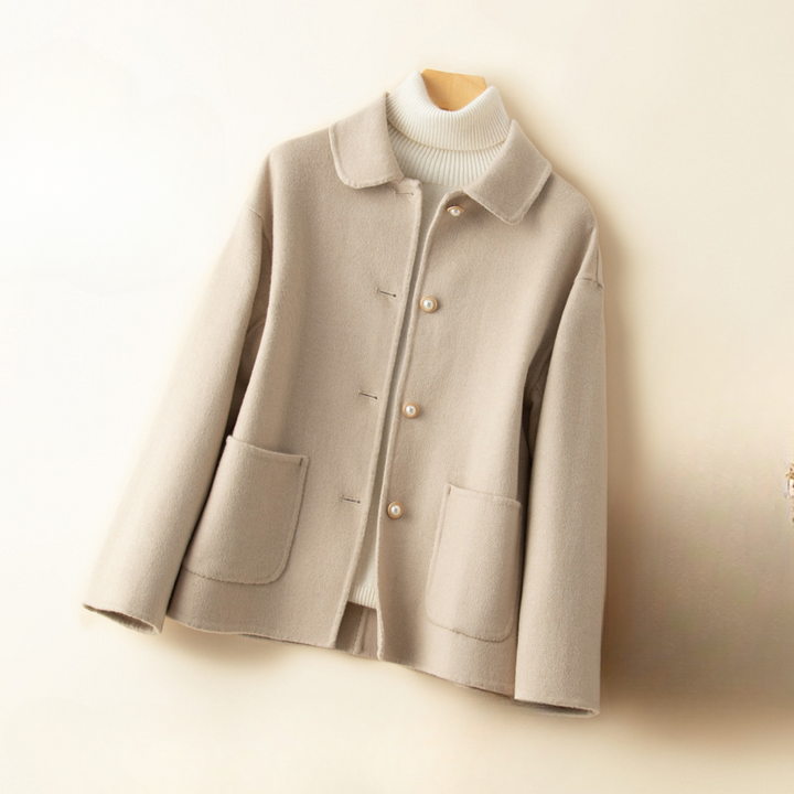 Luxury pure cashmere cropped coat for women, featuring a comfortable doll collar, perfect for sophisticated fall and winter outfits.