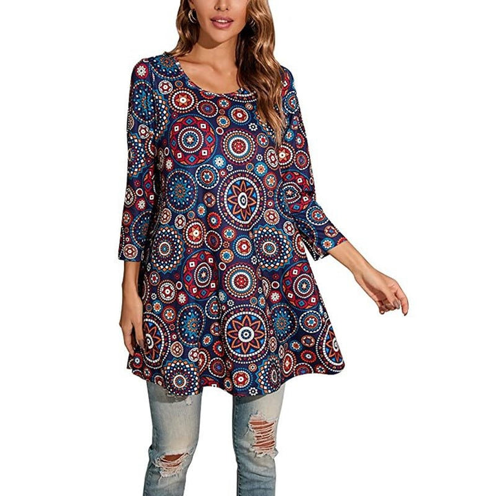 Detailed close-up of the vibrant mandala print on a women's swing tunic top. Boho chic, three-quarter sleeve style.