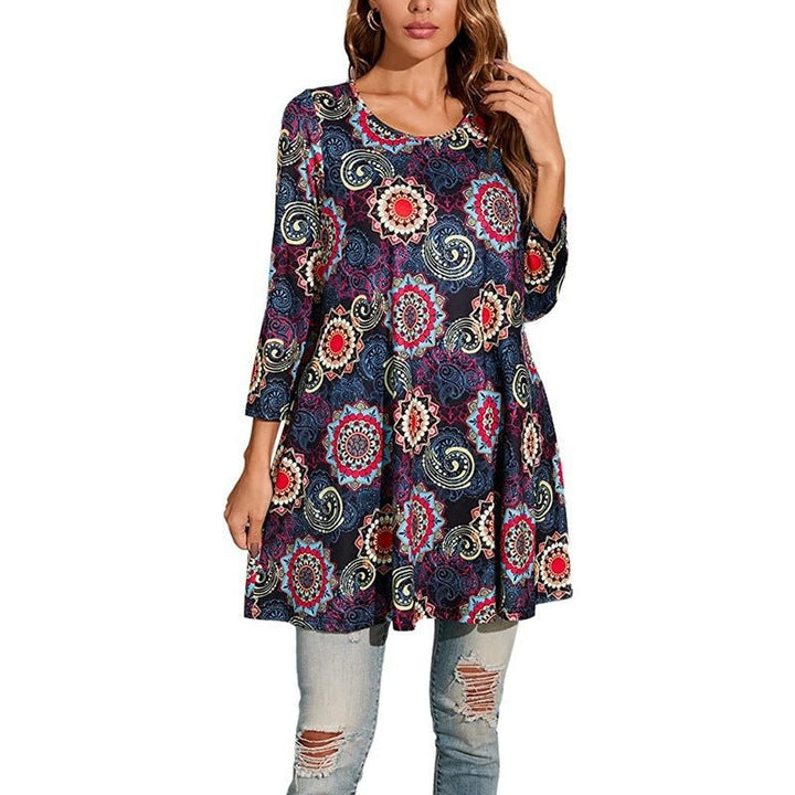 Side view of a woman in a flowy Mandala Print Swing Tunic Top. Relaxed fit, three-quarter sleeves for easy movement.