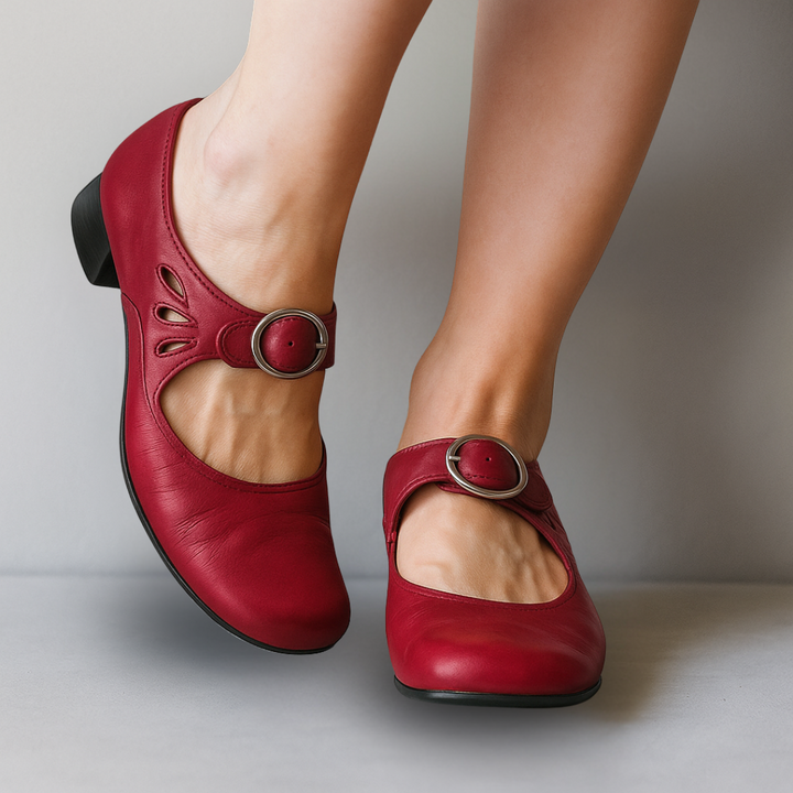 Classic women's Mary Jane shoes. Elegant rounded-toe design with a buckle strap and sturdy block heel.