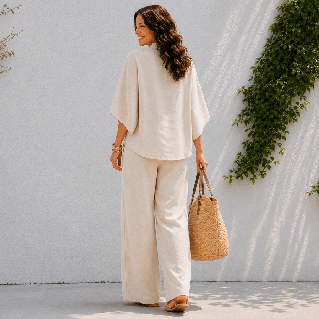 Casual women's two-piece set with flowy wide pants and oversized blouse for summer fashion.