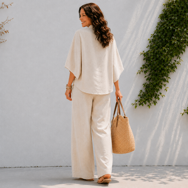 Casual women's two-piece set with flowy wide pants and oversized blouse for summer fashion.