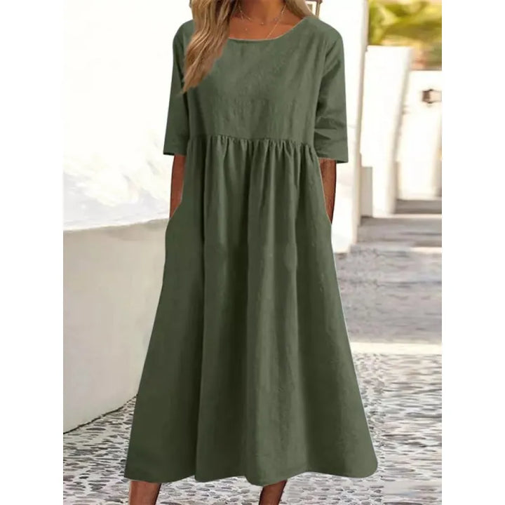 Women's maxi dress with pockets & half-sleeves for casual summer style.