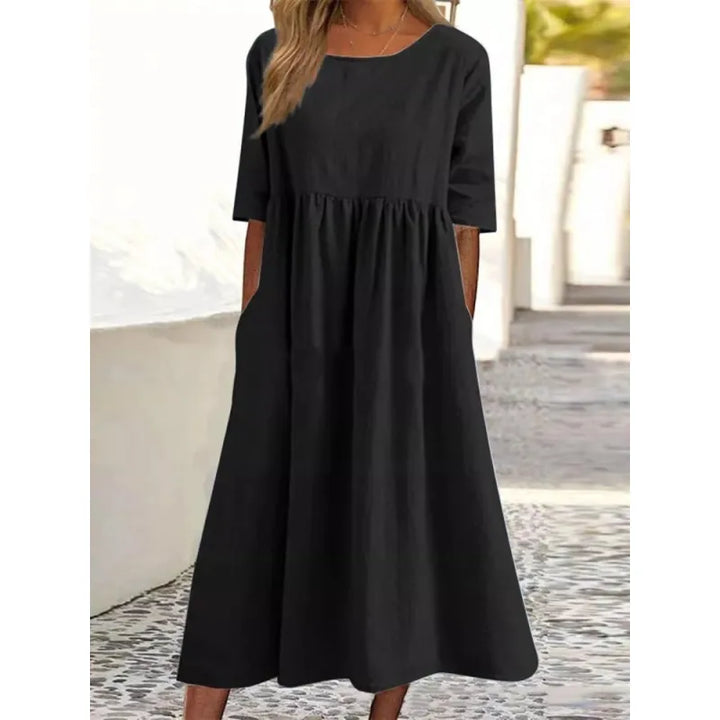 Comfortable women's flowing maxi dress with half-sleeves & pockets, perfect for summer.