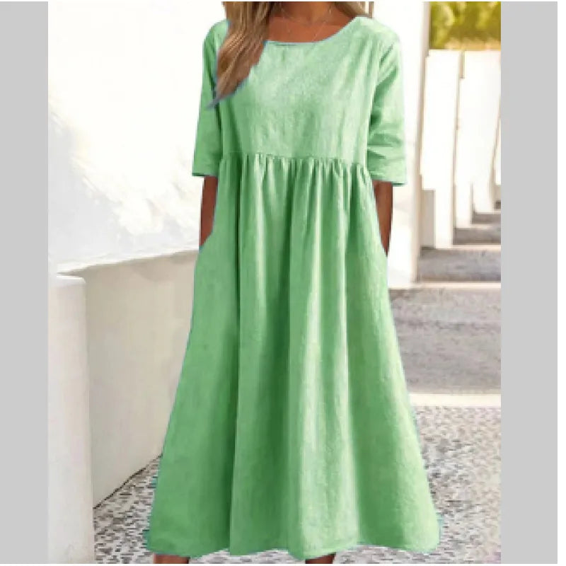 Versatile women's half-sleeve maxi dress with pockets, ideal for casual or summer wear.