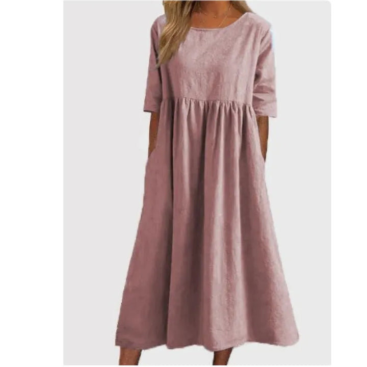 Women's casual long maxi dress with half-sleeves and pockets for everyday comfort.