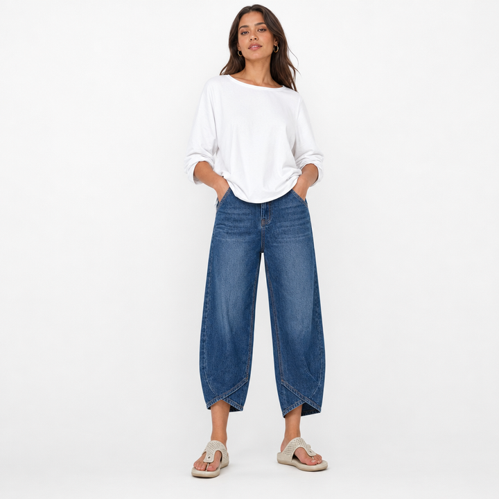 Stylish women's cropped denim jeans featuring a unique barrel leg & mid-rise design for a modern look.