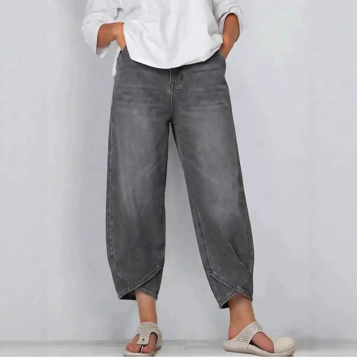 Close-up of women's mid-rise barrel leg cropped denim jeans texture & details. Quality fashion pants.