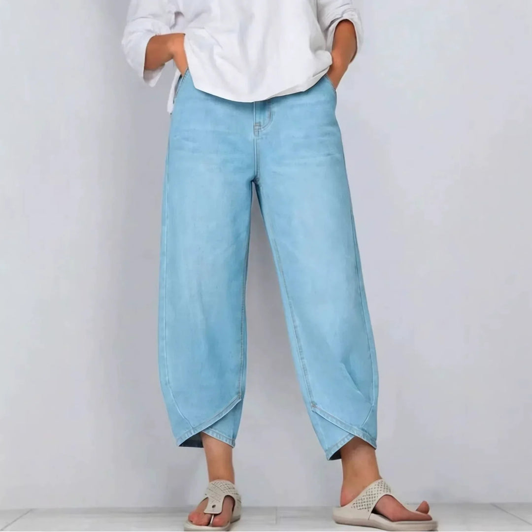Fashionable women's barrel leg jeans, cropped length & mid-rise fit. Comfortable denim for versatile styling.