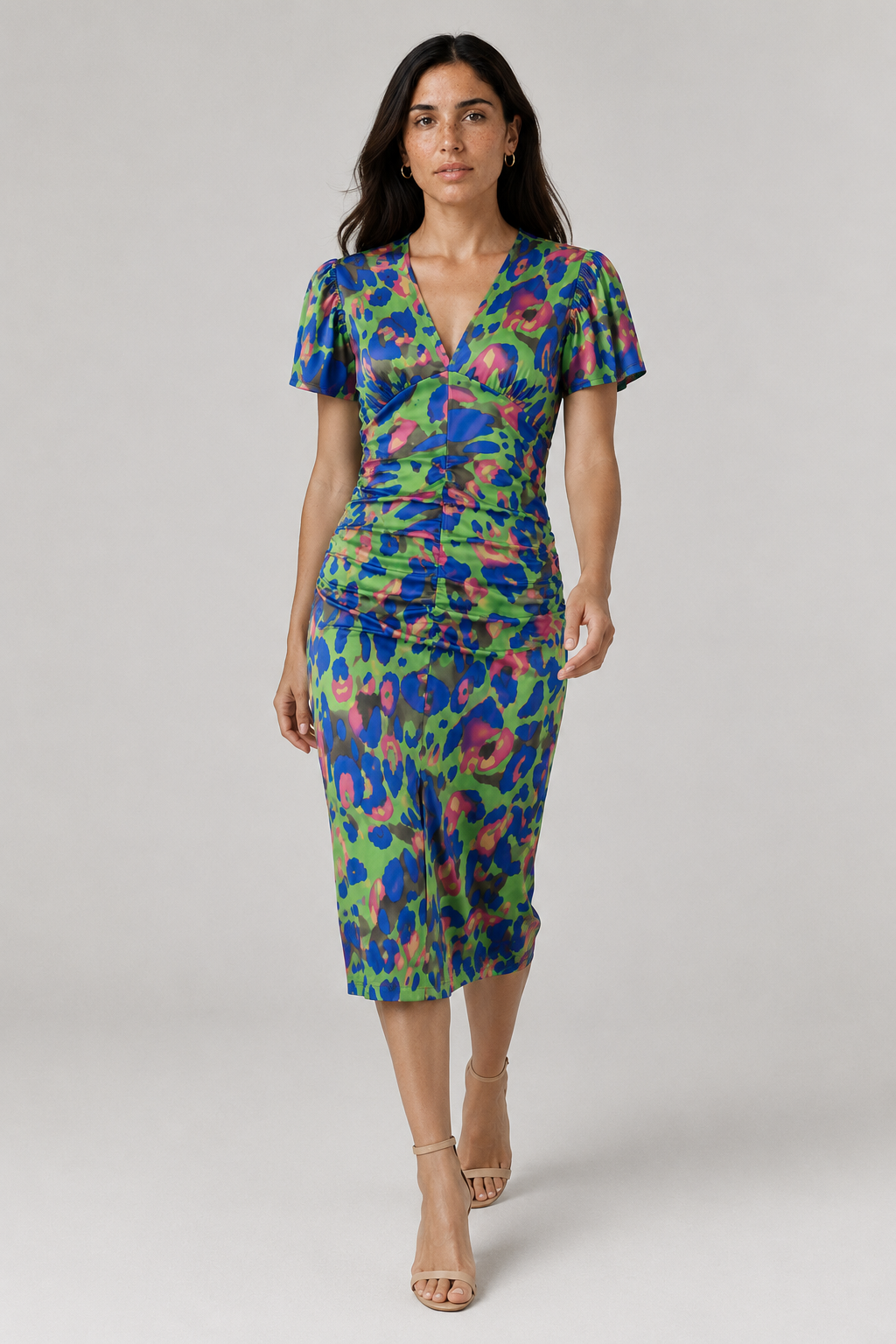 Vibrant abstract print midi dress for women, featuring chic puff sleeves and a flattering gathered waist. Ideal for summer.