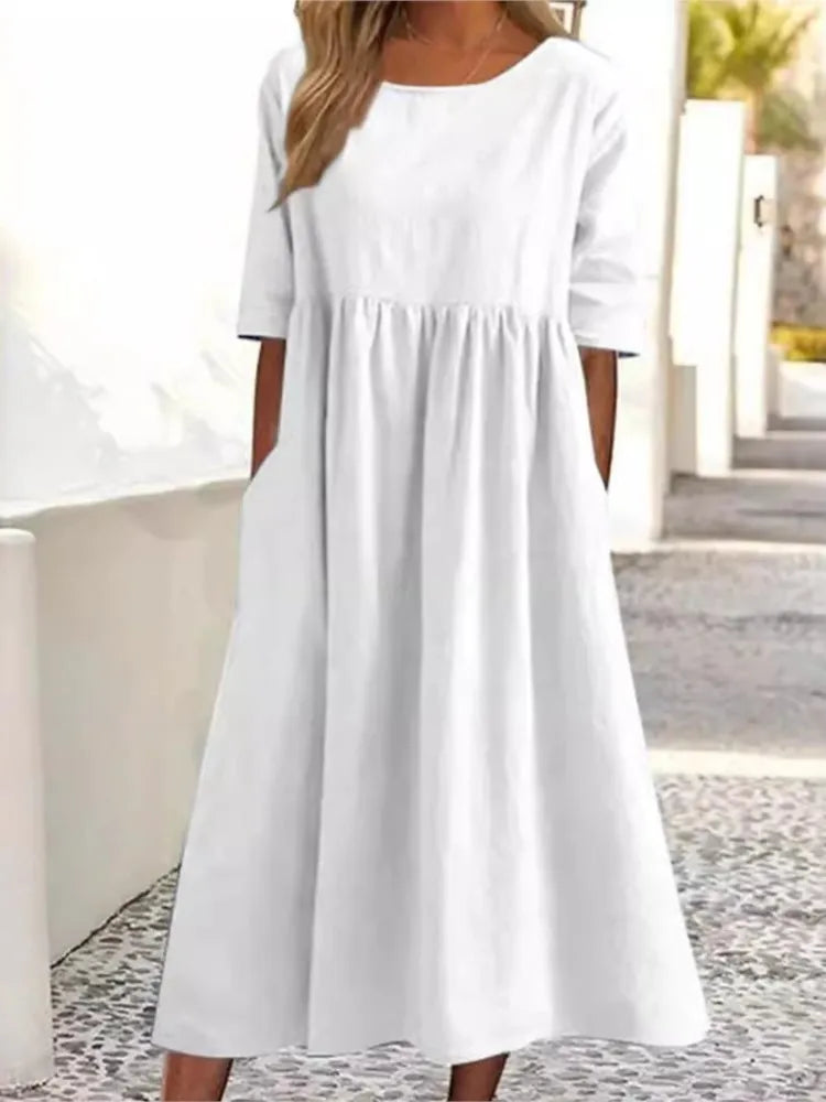 Versatile women's midi dress, round neck, effortless style for everyday wear. Casual summer flowy dress.
