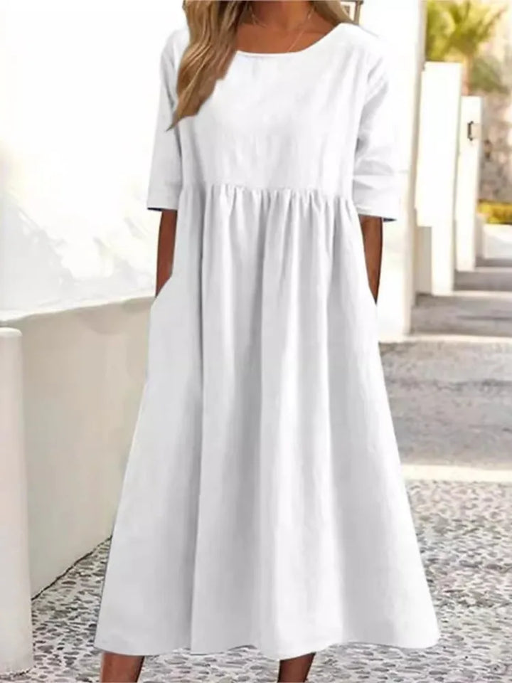 Versatile women's midi dress, round neck, effortless style for everyday wear. Casual summer flowy dress.