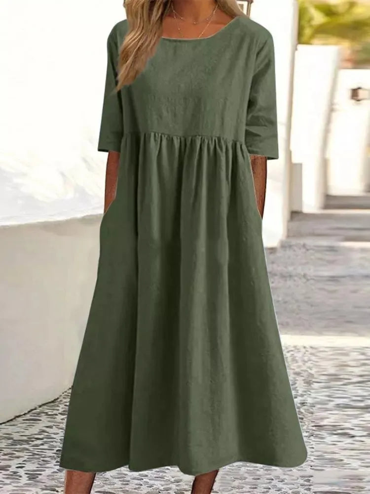 Comfortable women's short sleeve midi dress with round neck. Flowy, versatile, ideal for casual summer days.