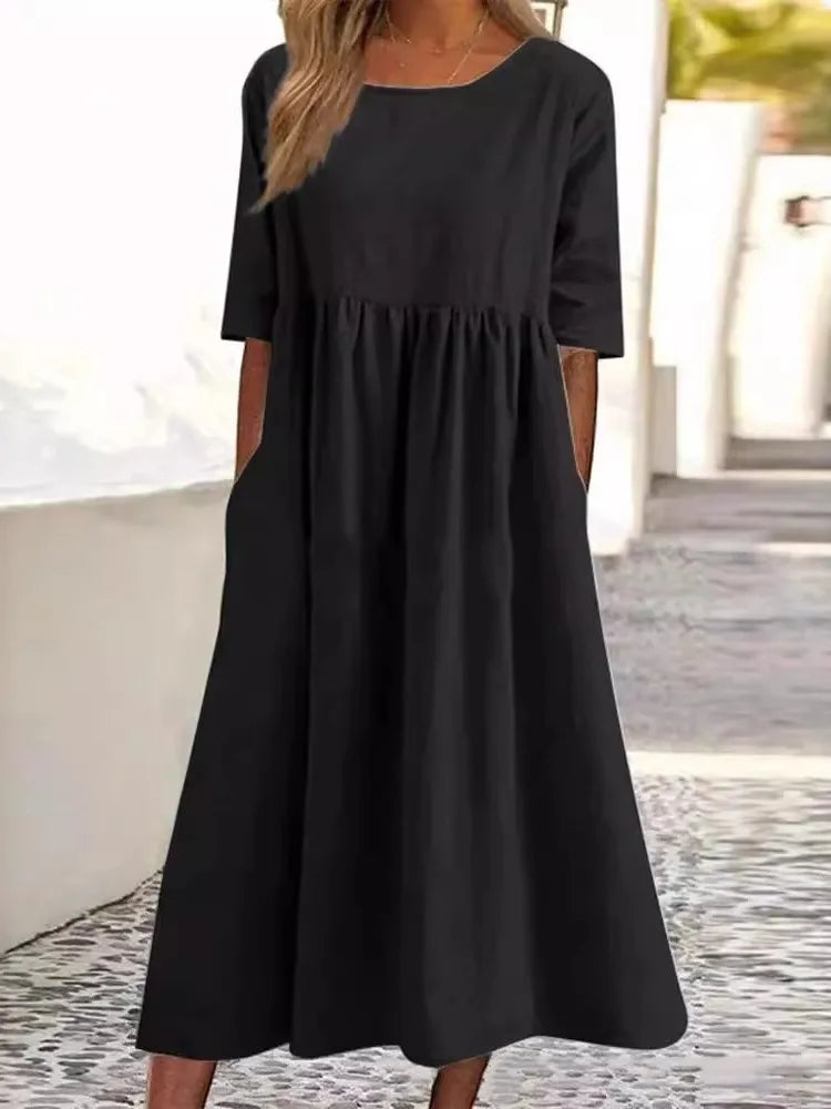 Everyday wear women's midi dress. Round neck, short sleeves, comfortable & versatile for any casual occasion.