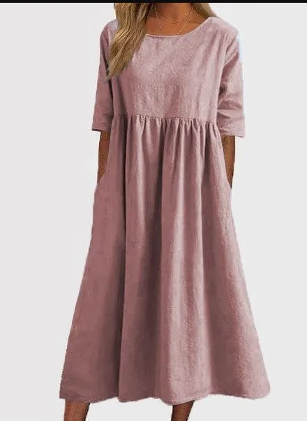 Casual women's midi dress, round neck, short sleeve. Comfortable & flowy for versatile summer fashion.