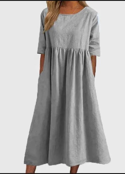 Women's round neck midi dress, short sleeve. Flowy, comfortable, and versatile for casual summer everyday wear.