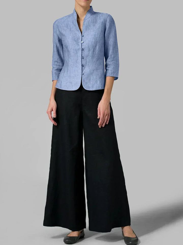 Women's casual chic button-front blouse. Minimalist 3/4 sleeve top, relaxed fit for versatile modern workwear.