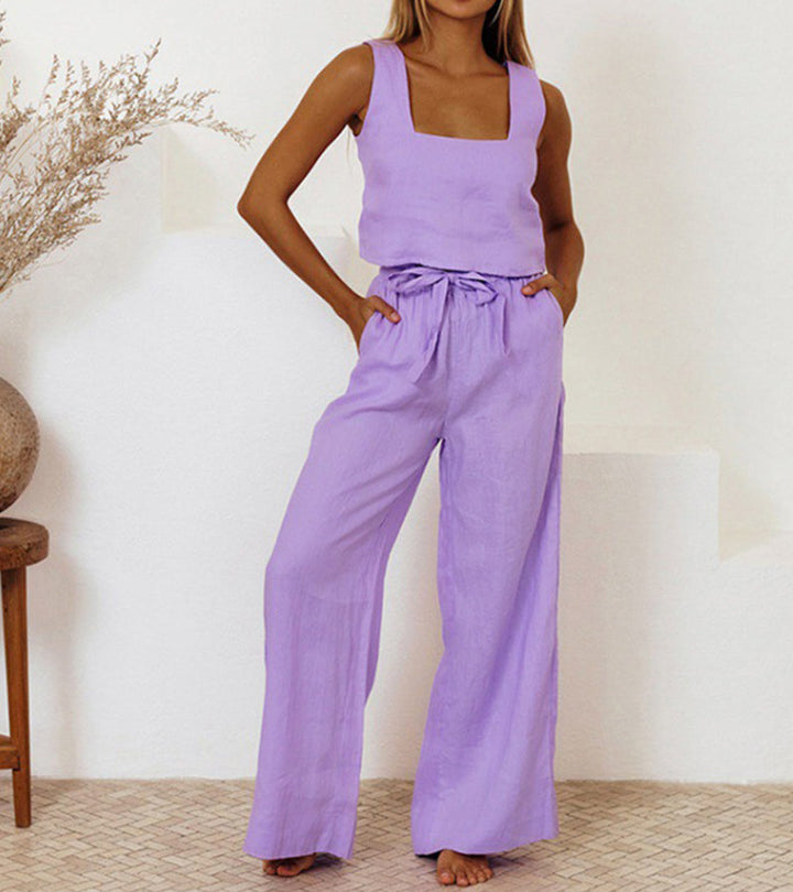 Stylish women's two-piece set with a sleek minimalist top & flowing wide-leg pants. Ideal for modern casual chic.