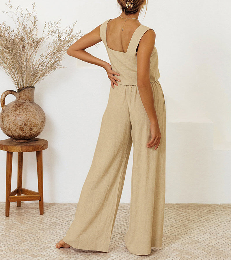 Modern women's minimalist two-piece for spring/summer. Features a chic top and comfortable wide-leg pants. Casual.