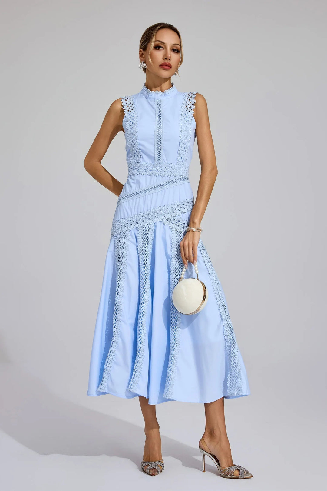 Stylish A-line midi dress for women, featuring a mock neck & intricate lace. A perfect wedding guest outfit.