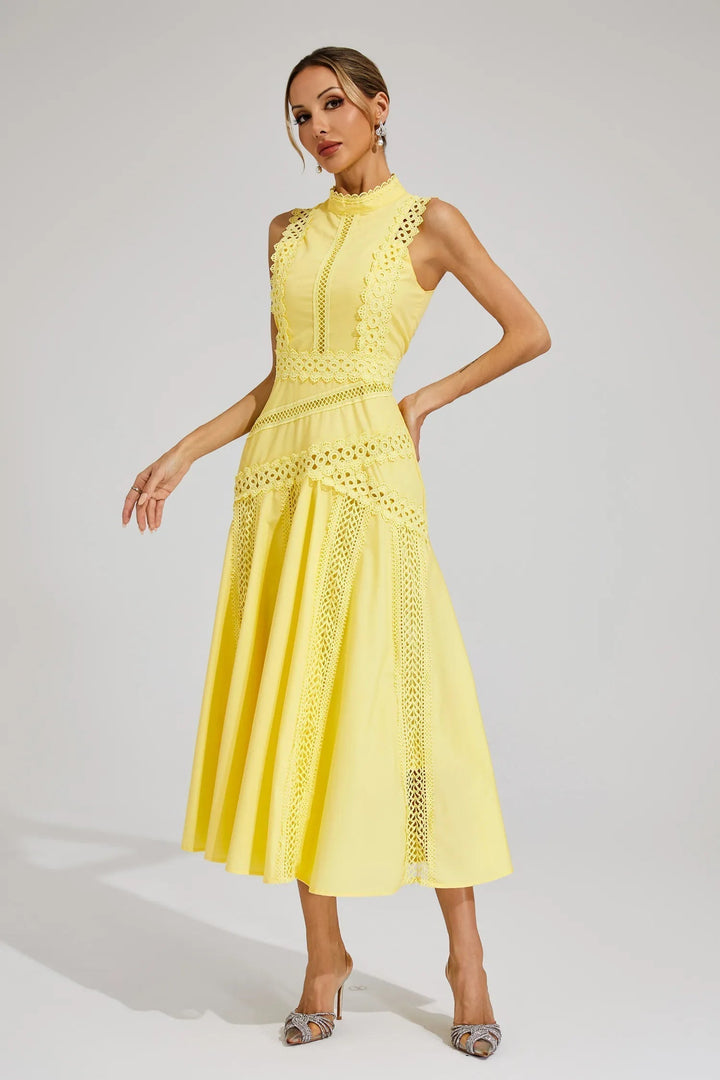 Summer wedding guest midi dress with elegant lace detail & mock neck. Sleeveless A-line for special occasions.