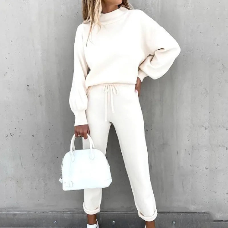 Two-piece women's set: mock neck top, drawstring waist pants. Great for stylish casual outfits.