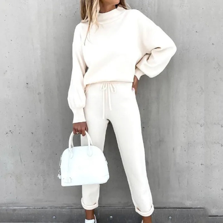 Two-piece women's set: mock neck top, drawstring waist pants. Great for stylish casual outfits.