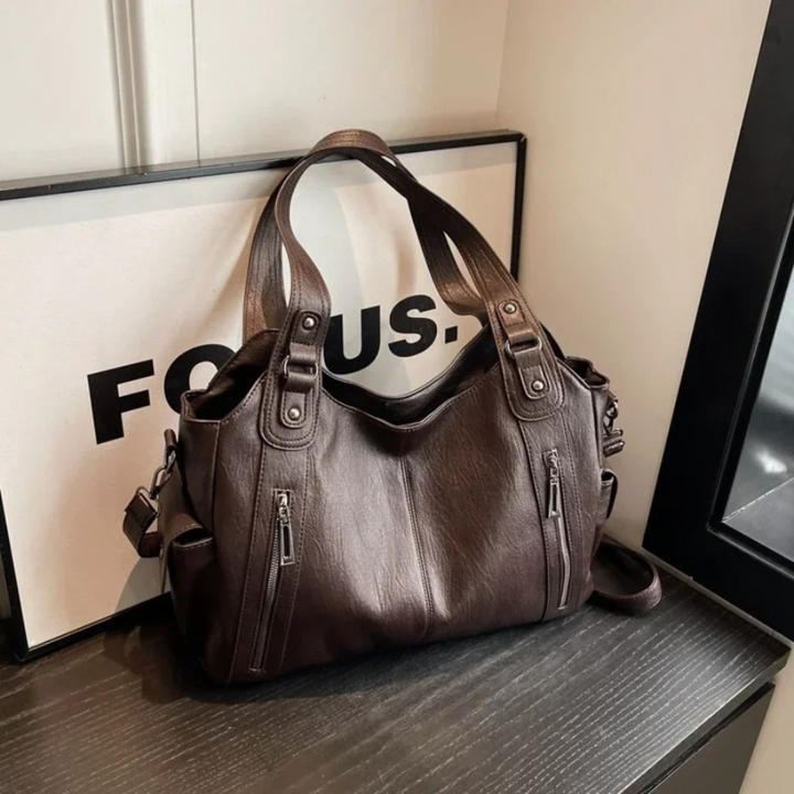 Elegant women's multi-compartment shoulder purse, offering organized storage for all your everyday essentials.