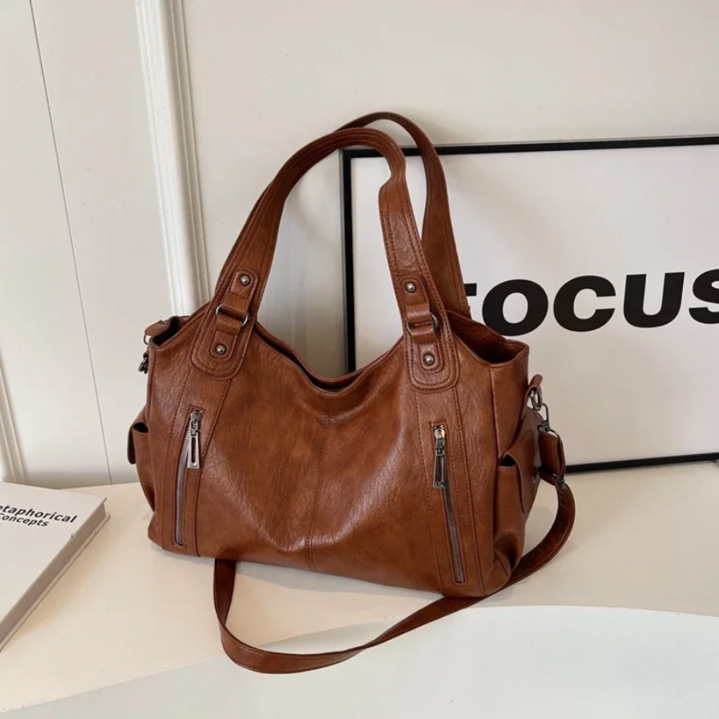Stylish & organized women's multi-compartment shoulder bag, perfect for carrying essentials with ease and elegance.