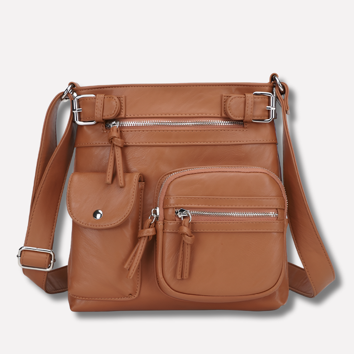 Stylish coffee women's crossbody bag, compact with multiple pockets & adjustable strap.