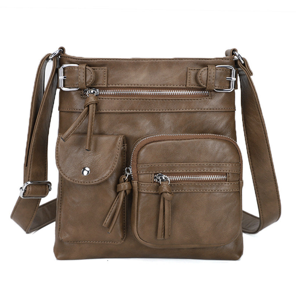 Fashionable women's crossbody bag, compact with multiple pockets for organized, stylish carry.