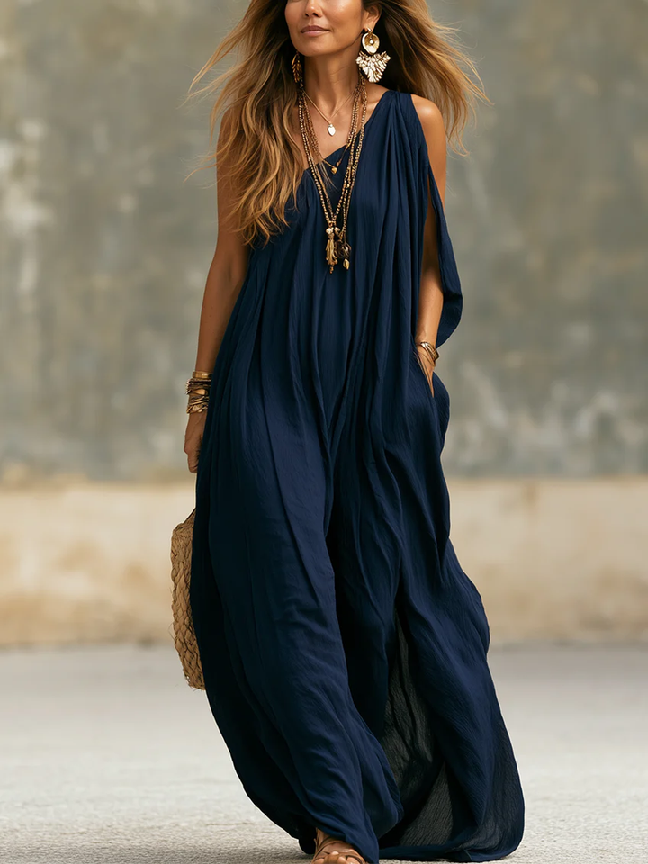 Women's navy one-shoulder wide leg jumpsuit, draped bohemian style for elegant summer resort wear.
