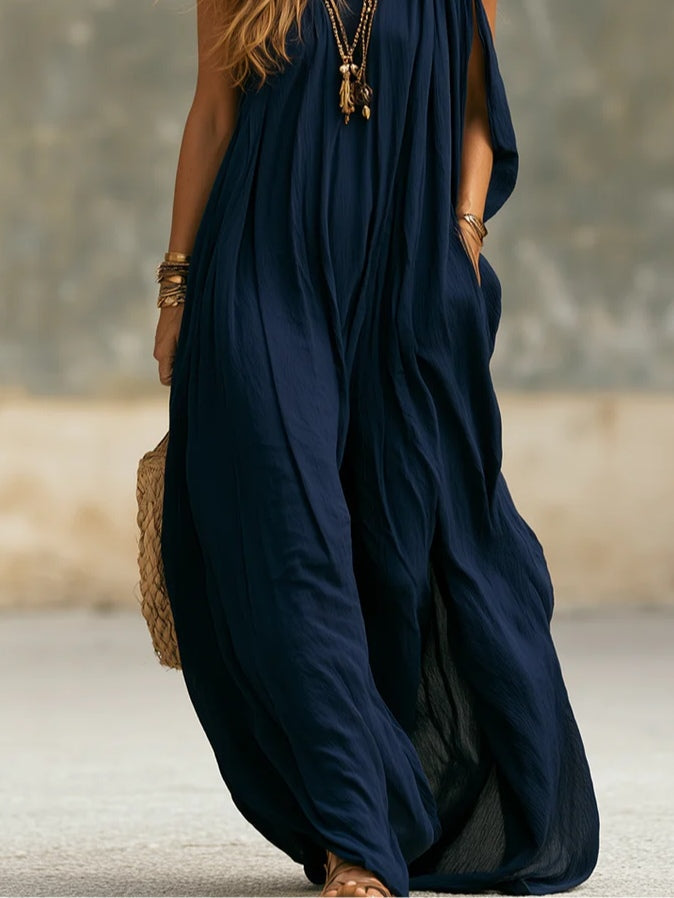 Elegant women's navy one-shoulder jumpsuit with a draped wide leg. Ideal for summer, resort, or chic events.
