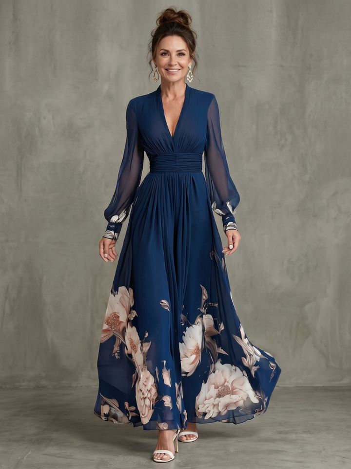 Women's navy V-neck pleated maxi dress with elegant sheer long sleeves, perfect for summer occasions.